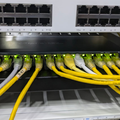 Network switch with yellow Ethernet cables in the L7 Group data center