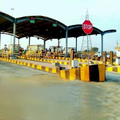 Toll plaza lanes with STOP sign where L7 Group set up FASTag services in Maharashtra