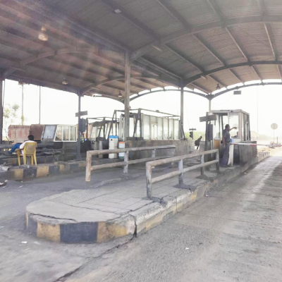 Toll booths under the plaza canopy at a FASTag deployment site in Maharashtra